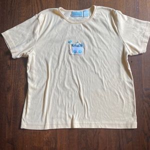 Light yellow T-shirt with flower bed and butterfly design size L